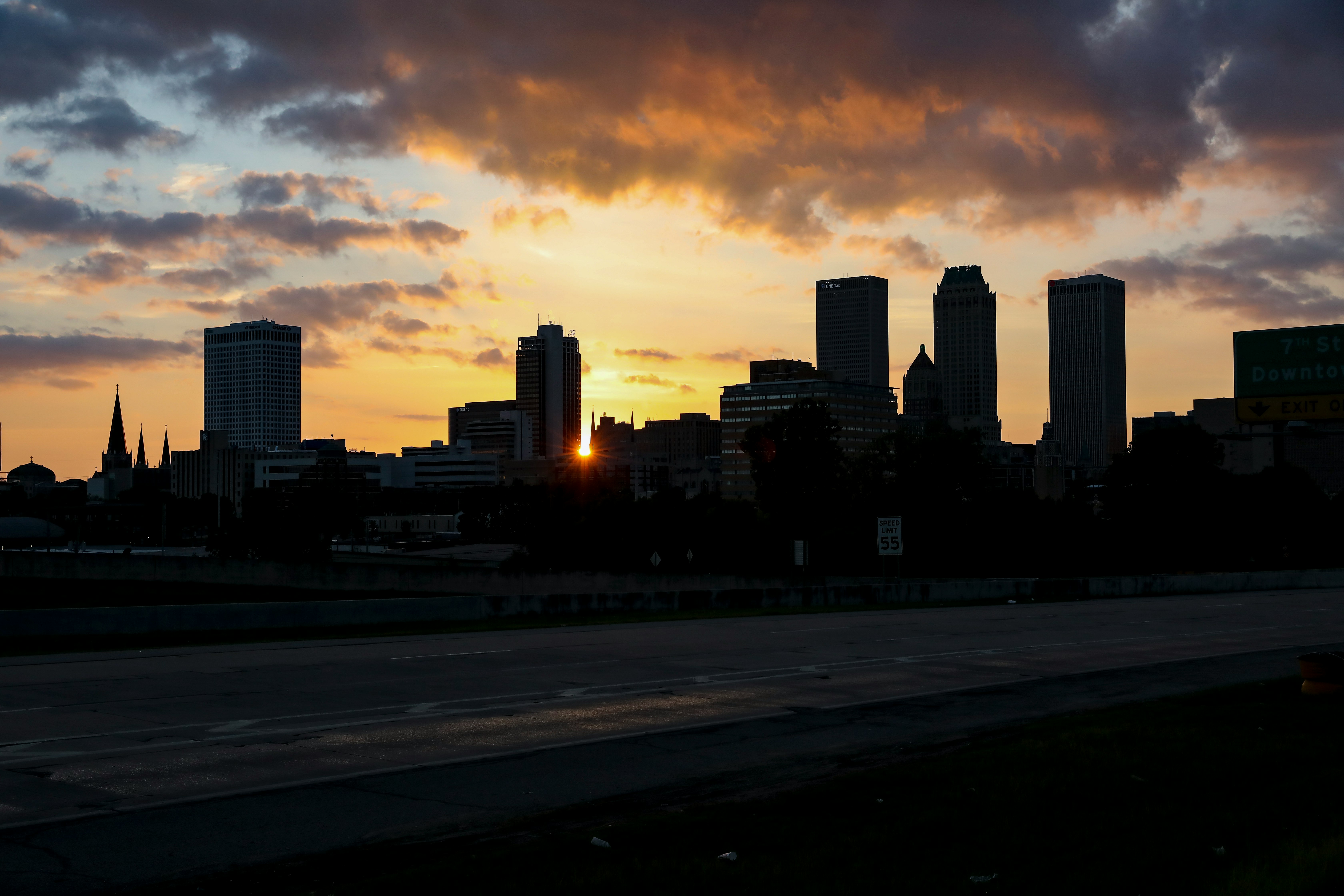 city skyline during sunset with cloudy sky